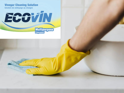 Yellow‑gloved hand wipes countertop with cloth; EcoVin multipurpose vinegar cleaning solution logo shown in top corner.